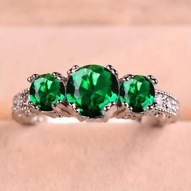 Dahlia | Timeless Ring with Sparkling Emerald Stones